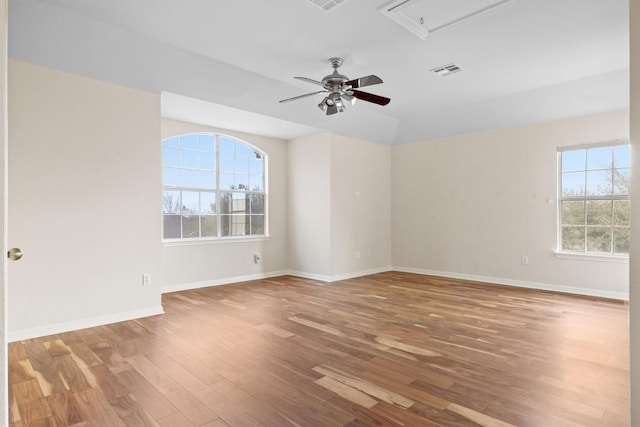2701 Blackstone Cv, Round Rock, TX 78665 - unfurnished room featuring attic access, wood finished floors, ceiling fan, and baseboards