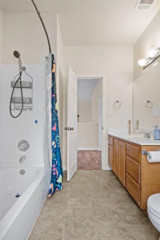 2701 Blackstone Cv, Round Rock, TX 78665 - bathroom with vanity, shower / tub combo, and toilet