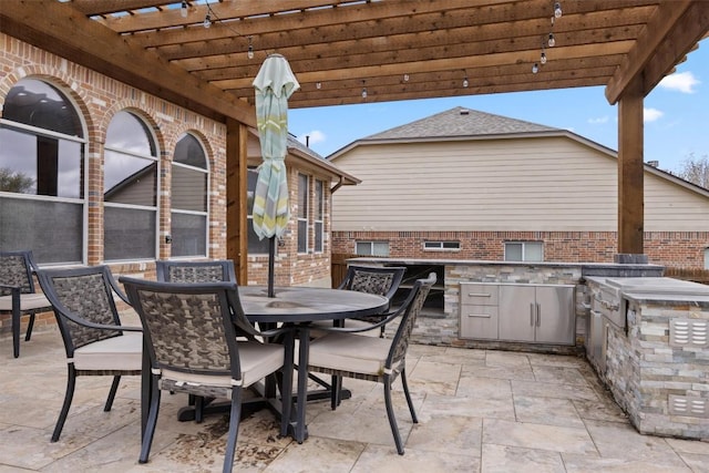 2701 Blackstone Cv, Round Rock, TX 78665 - view of patio featuring an outdoor kitchen, a pergola, and outdoor dining area