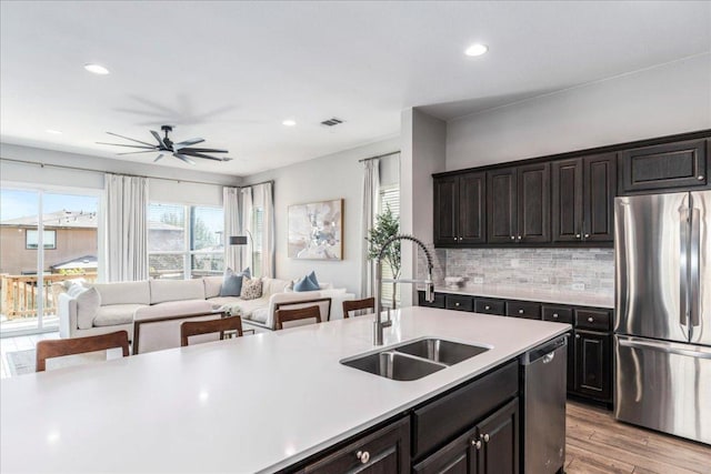 9003 Jodie Ln, Austin, TX 78748 - kitchen featuring appliances with stainless steel finishes, a sink, light countertops, recessed lighting, and ceiling fan