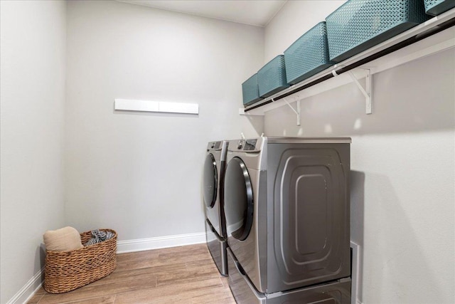 9003 Jodie Ln, Austin, TX 78748 - laundry room featuring wood finished floors, washing machine and dryer, and baseboards