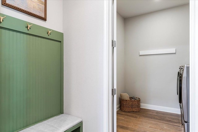 9003 Jodie Ln, Austin, TX 78748 - mudroom with wood finished floors, baseboards, and separate washer and dryer