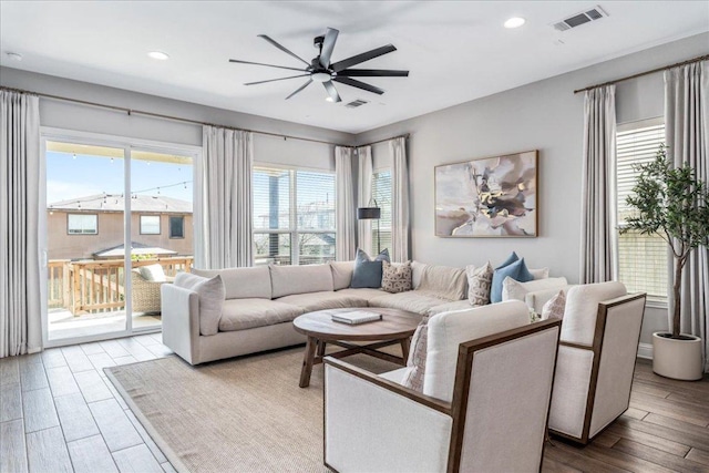 9003 Jodie Ln, Austin, TX 78748 - living area featuring ceiling fan, wood finished floors, and recessed lighting