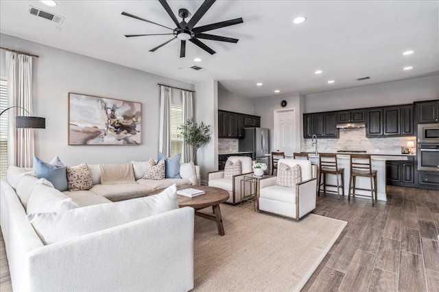 9003 Jodie Ln, Austin, TX 78748 - living room with a ceiling fan, dark wood finished floors, and recessed lighting