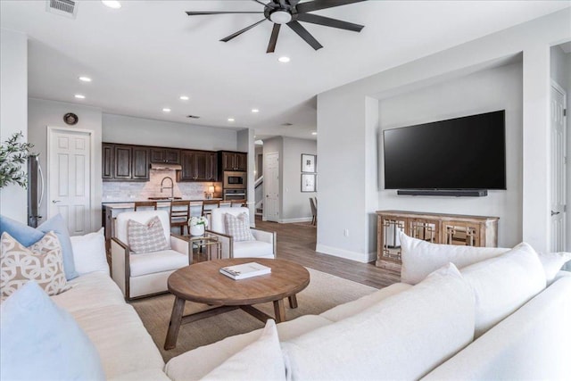 9003 Jodie Ln, Austin, TX 78748 - living room with a ceiling fan, baseboards, recessed lighting, and light wood-style flooring
