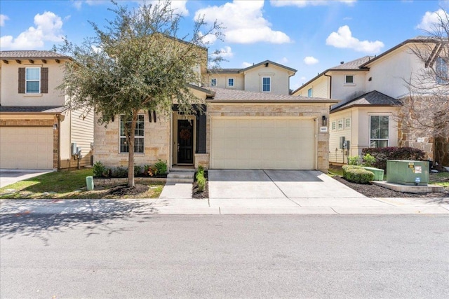 9003 Jodie Ln, Austin, TX 78748 - view of front facade with concrete driveway, an attached garage, and stone siding