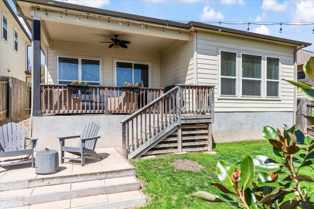 9003 Jodie Ln, Austin, TX 78748 - view of front facade featuring ceiling fan, a fenced backyard, stairs, and a patio