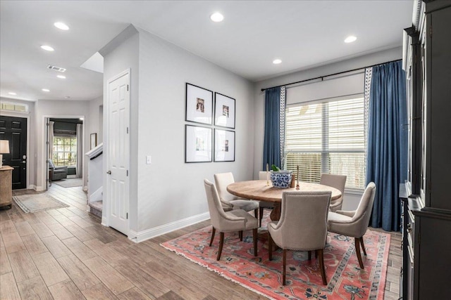 9003 Jodie Ln, Austin, TX 78748 - dining room featuring baseboards, light wood-style floors, recessed lighting, and stairs