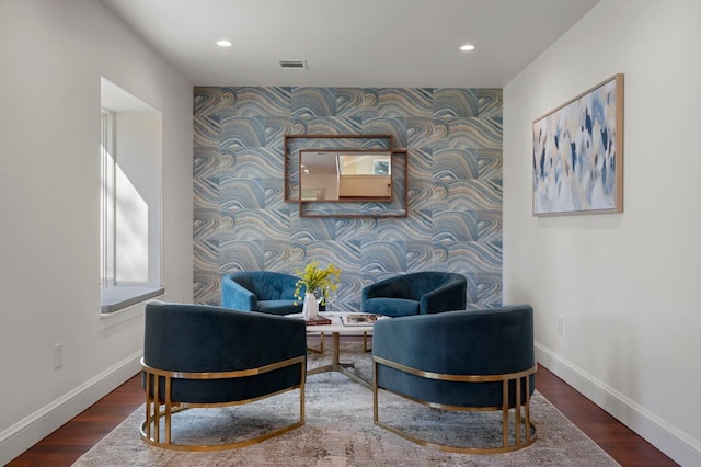 7603 Rustling Cv, Austin, TX 78731 - living area with an accent wall, wallpapered walls, recessed lighting, and wood finished floors