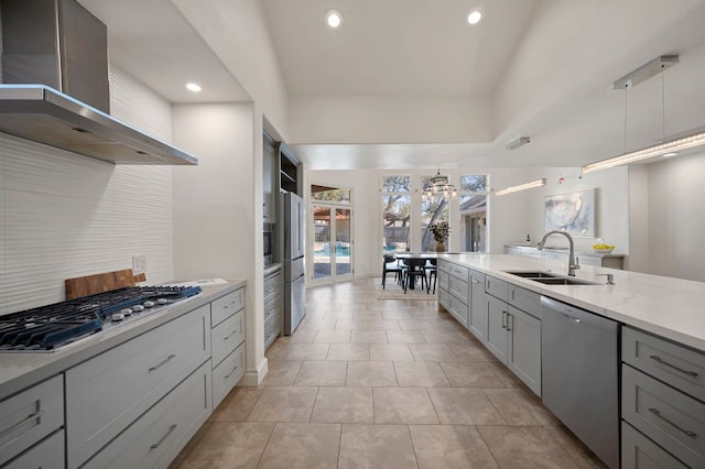 7603 Rustling Cv, Austin, TX 78731 - kitchen with stainless steel appliances, wall chimney exhaust hood, backsplash, gray cabinetry, and recessed lighting