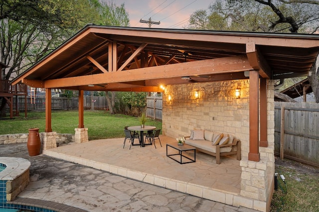 7603 Rustling Cv, Austin, TX 78731 - patio terrace at dusk with a patio, a fenced backyard, a gazebo, and outdoor dining area