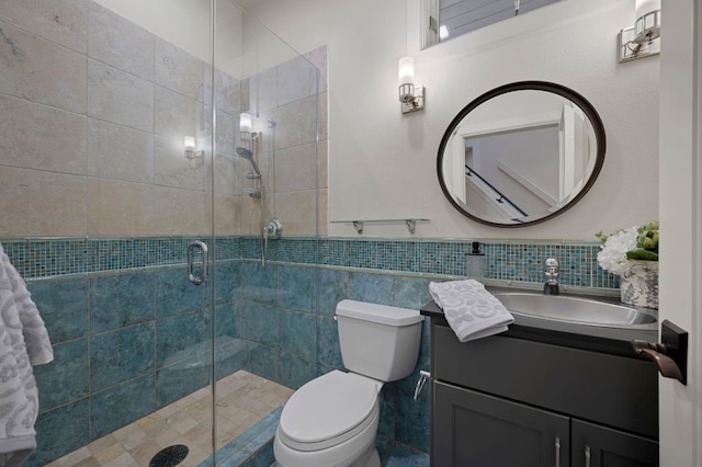 7603 Rustling Cv, Austin, TX 78731 - full bathroom with a shower stall, tile walls, and vanity