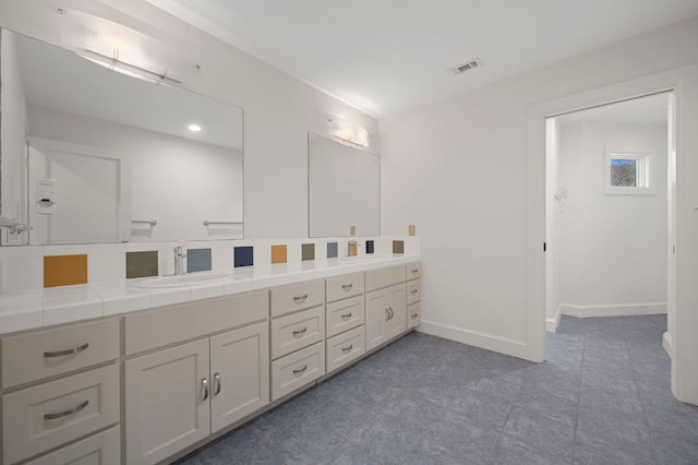 7603 Rustling Cv, Austin, TX 78731 - full bathroom with double vanity and tile patterned flooring