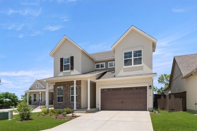 600 C-Bar Ranch Trl Unit 116, Cedar Park, TX 78613 - view of front of home featuring an attached garage, a porch, a shingled roof, concrete driveway, and brick siding