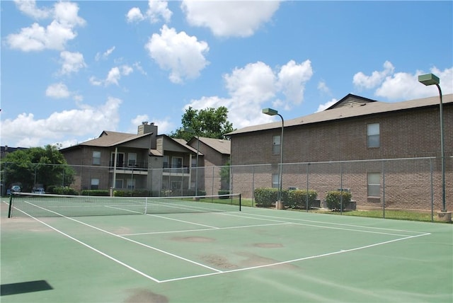 12166 Metric Blvd Unit 340, Austin, TX 78758 - view of tennis court with community basketball court