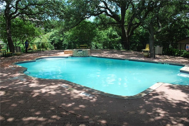 12166 Metric Blvd Unit 340, Austin, TX 78758 - view of swimming pool with a patio, view of scattered trees, and a pool with connected hot tub