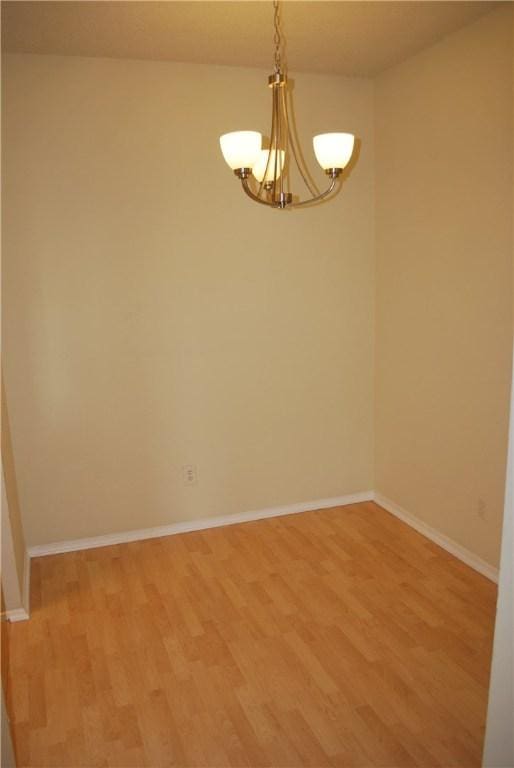 12166 Metric Blvd Unit 340, Austin, TX 78758 - unfurnished room with a chandelier and light wood-type flooring