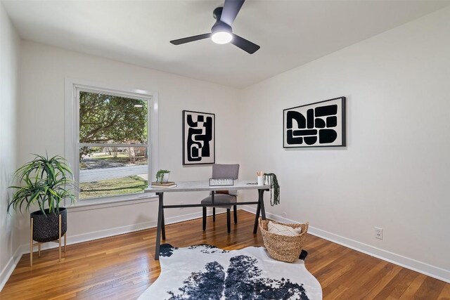 2708 W 49th St W, Austin, TX 78731 - home office with a ceiling fan, wood finished floors, and baseboards