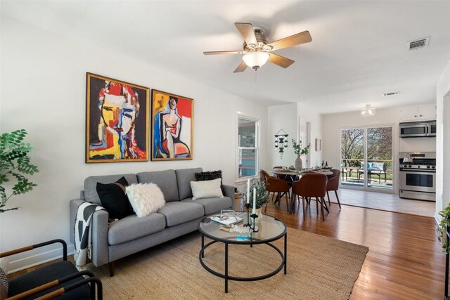 2708 W 49th St W, Austin, TX 78731 - living room with a ceiling fan and light wood finished floors