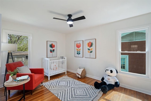 2708 W 49th St W, Austin, TX 78731 - bedroom featuring wood finished floors, baseboards, and a ceiling fan