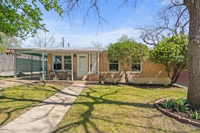 2708 W 49th St W, Austin, TX 78731 - view of front of home with brick siding, an attached carport, a porch, and driveway