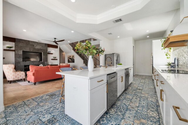 503 Eagle, Lakeway, TX 78734 - kitchen featuring appliances with stainless steel finishes, a sink, white cabinets, light countertops, and recessed lighting