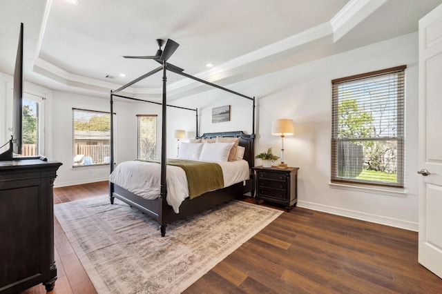 503 Eagle, Lakeway, TX 78734 - bedroom with a tray ceiling, dark wood-style flooring, crown molding, baseboards, and recessed lighting