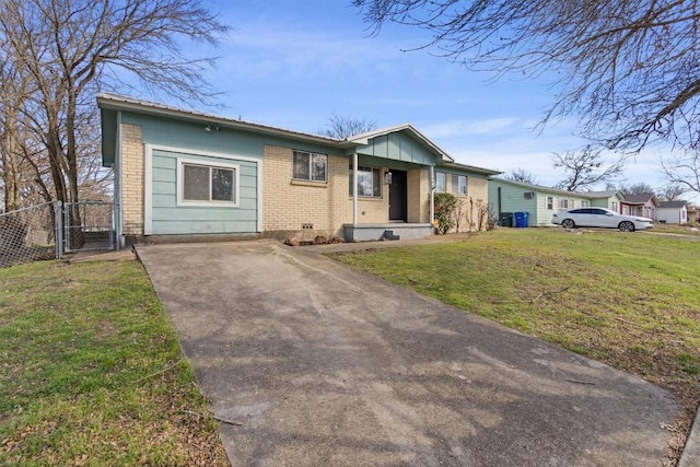 703 S 13th St, Copperas Cove, TX 76522 - ranch-style house with brick siding, driveway, a gate, and board and batten siding
