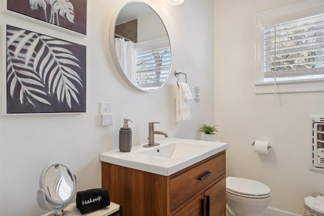 1213 S Church St, Georgetown, TX 78626 - bathroom featuring toilet, vanity, and healthy amount of natural light