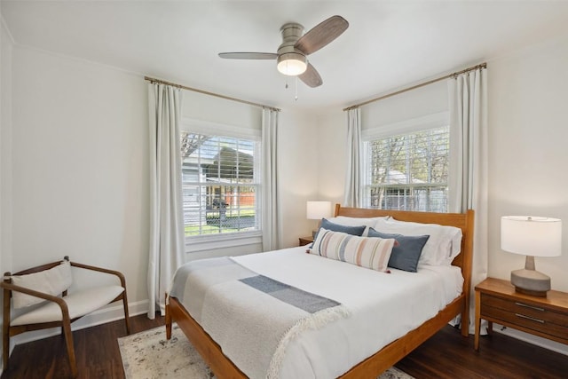 1213 S Church St, Georgetown, TX 78626 - bedroom with dark wood-style floors, baseboards, and ceiling fan