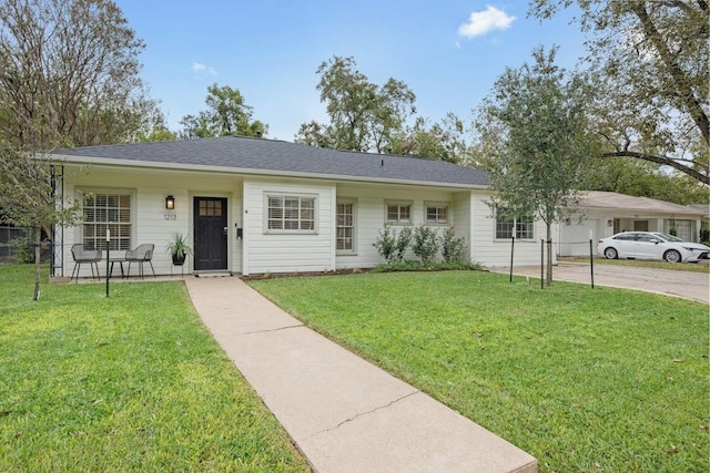 1213 S Church St, Georgetown, TX 78626 - ranch-style home with a front lawn and driveway