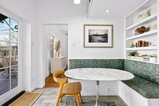dining room featuring breakfast area, a wealth of natural light, light wood finished floors, and recessed lighting