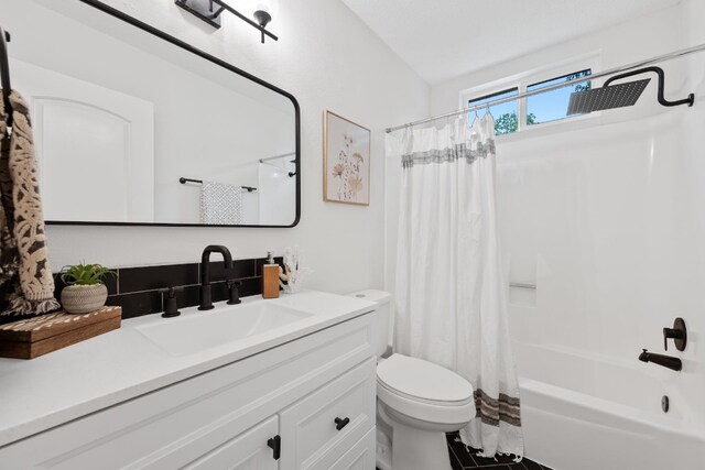 125 Chaparral St, San Marcos, TX 78666 - full bath featuring vanity, toilet, and shower / bath combination with curtain