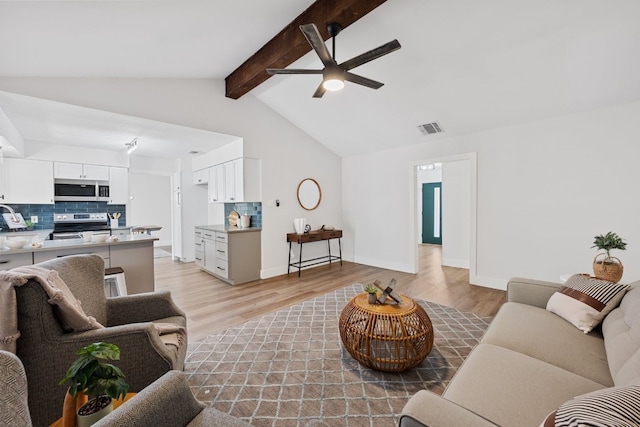 125 Chaparral St, San Marcos, TX 78666 - living area with ceiling fan, light wood-type flooring, and baseboards