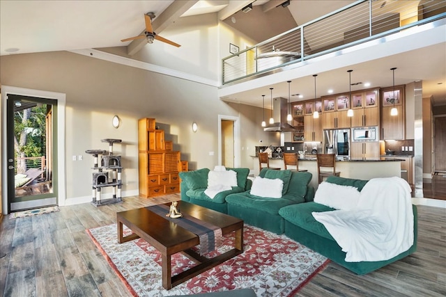 1002 Arroweye Trl, Austin, TX 78733 - living room featuring wood finished floors, high vaulted ceiling, a ceiling fan, baseboards, and beam ceiling