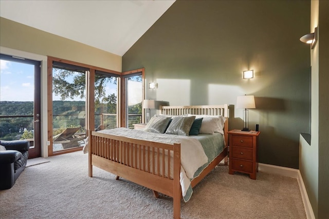 1002 Arroweye Trl, Austin, TX 78733 - bedroom featuring access to exterior, carpet floors, high vaulted ceiling, and baseboards