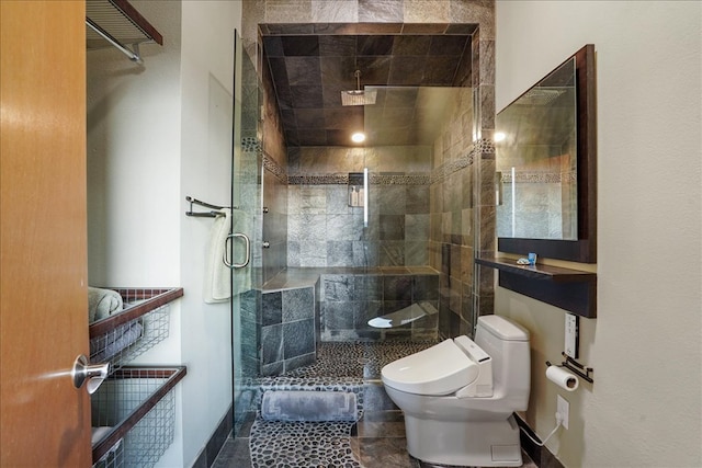 1002 Arroweye Trl, Austin, TX 78733 - full bathroom featuring toilet, a shower stall, and baseboards