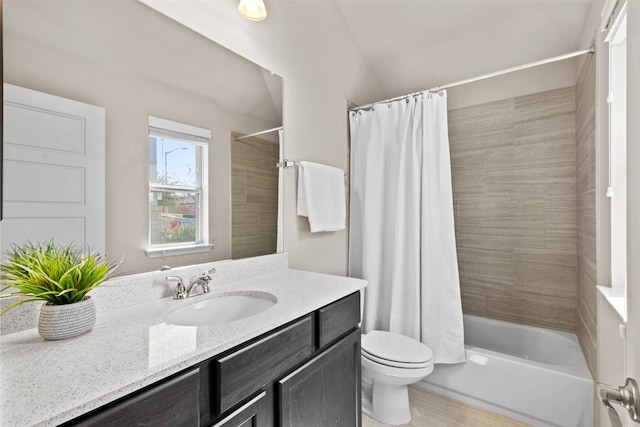 full bathroom featuring toilet, vanity, and shower / bath combo with shower curtain