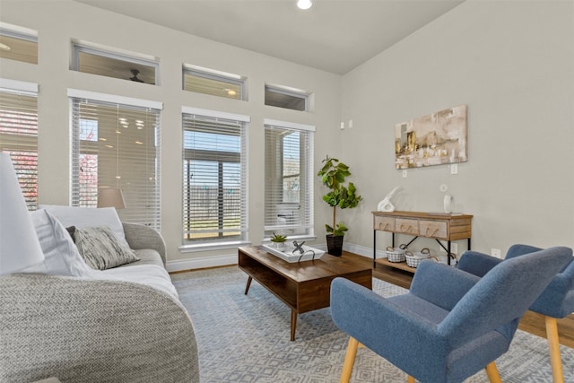 living room featuring recessed lighting, baseboards, and wood finished floors