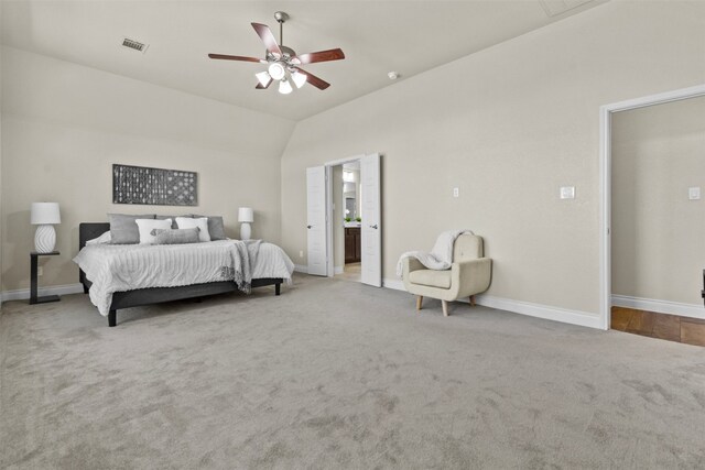 bedroom featuring carpet flooring, visible vents, baseboards, ceiling fan, and lofted ceiling