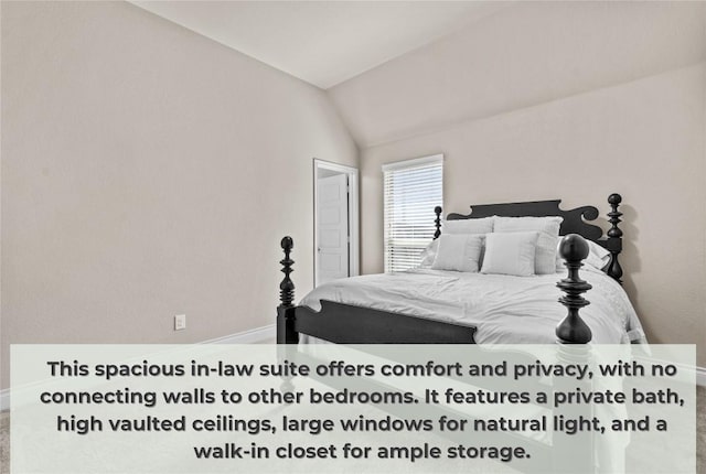 bedroom featuring baseboards and vaulted ceiling