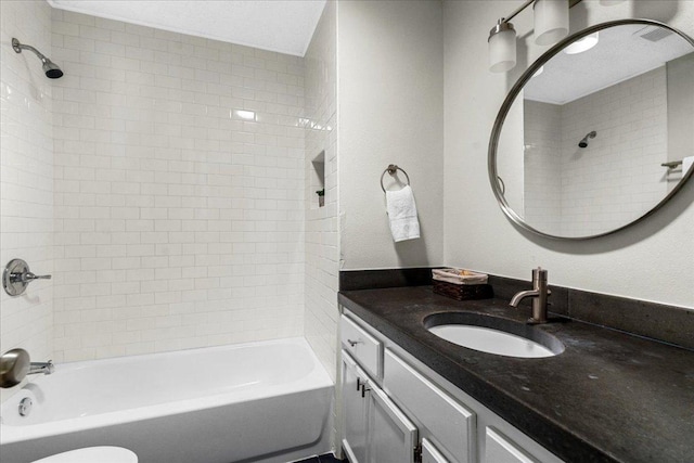 bathroom featuring vanity and tub / shower combination