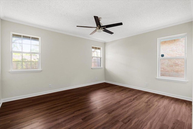 empty room with crown molding, a textured ceiling, a ceiling fan, baseboards, and dark wood-style floors