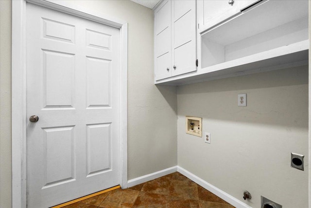 laundry room featuring cabinet space, hookup for an electric dryer, baseboards, and hookup for a washing machine