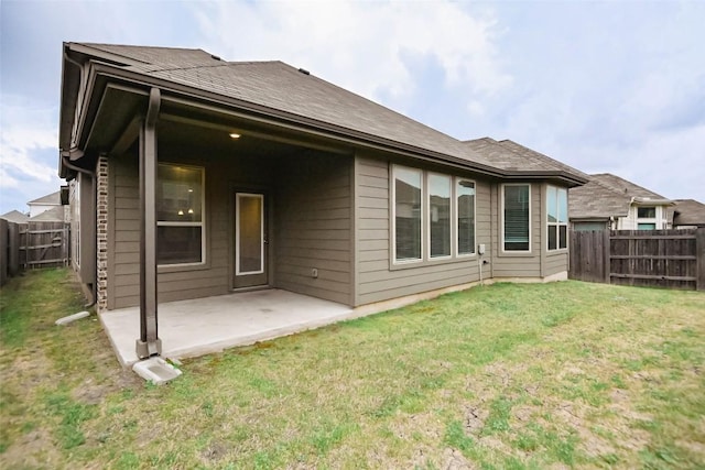 908 Leadtree Loop, Buda, TX 78610 - rear view of property with a patio and a shingled roof