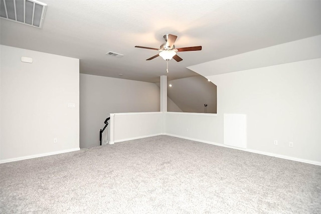 908 Leadtree Loop, Buda, TX 78610 - additional living space with a ceiling fan, carpet floors, vaulted ceiling, and baseboards