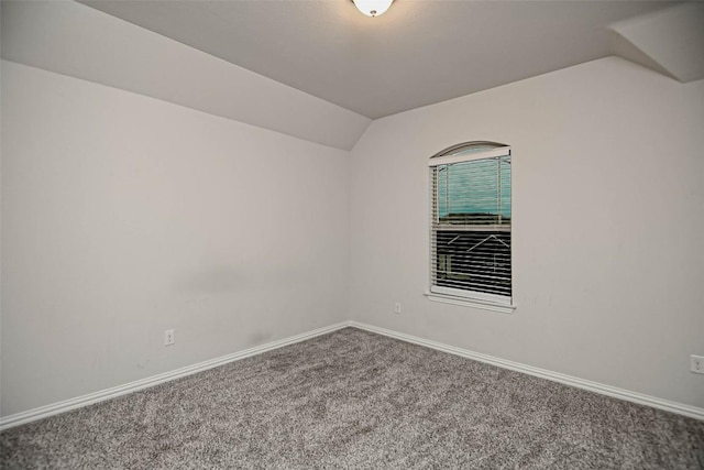 908 Leadtree Loop, Buda, TX 78610 - spare room with carpet flooring, lofted ceiling, and baseboards