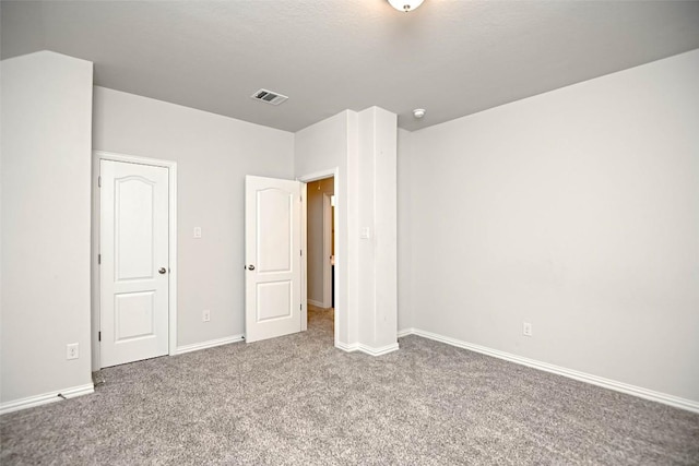 908 Leadtree Loop, Buda, TX 78610 - unfurnished bedroom with carpet flooring and baseboards