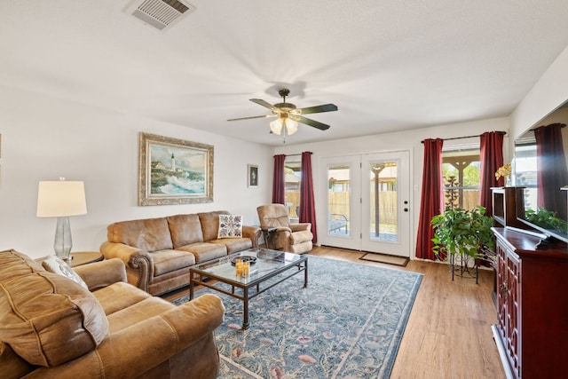 3919 Haleys Way, Round Rock, TX 78665 - living area with ceiling fan and light wood-style floors