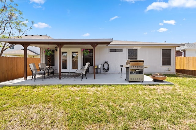 3919 Haleys Way, Round Rock, TX 78665 - rear view of house with a fire pit, a patio, and french doors